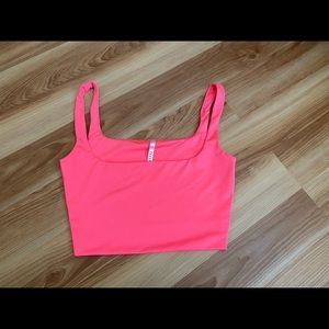 Two hot pink crop tops